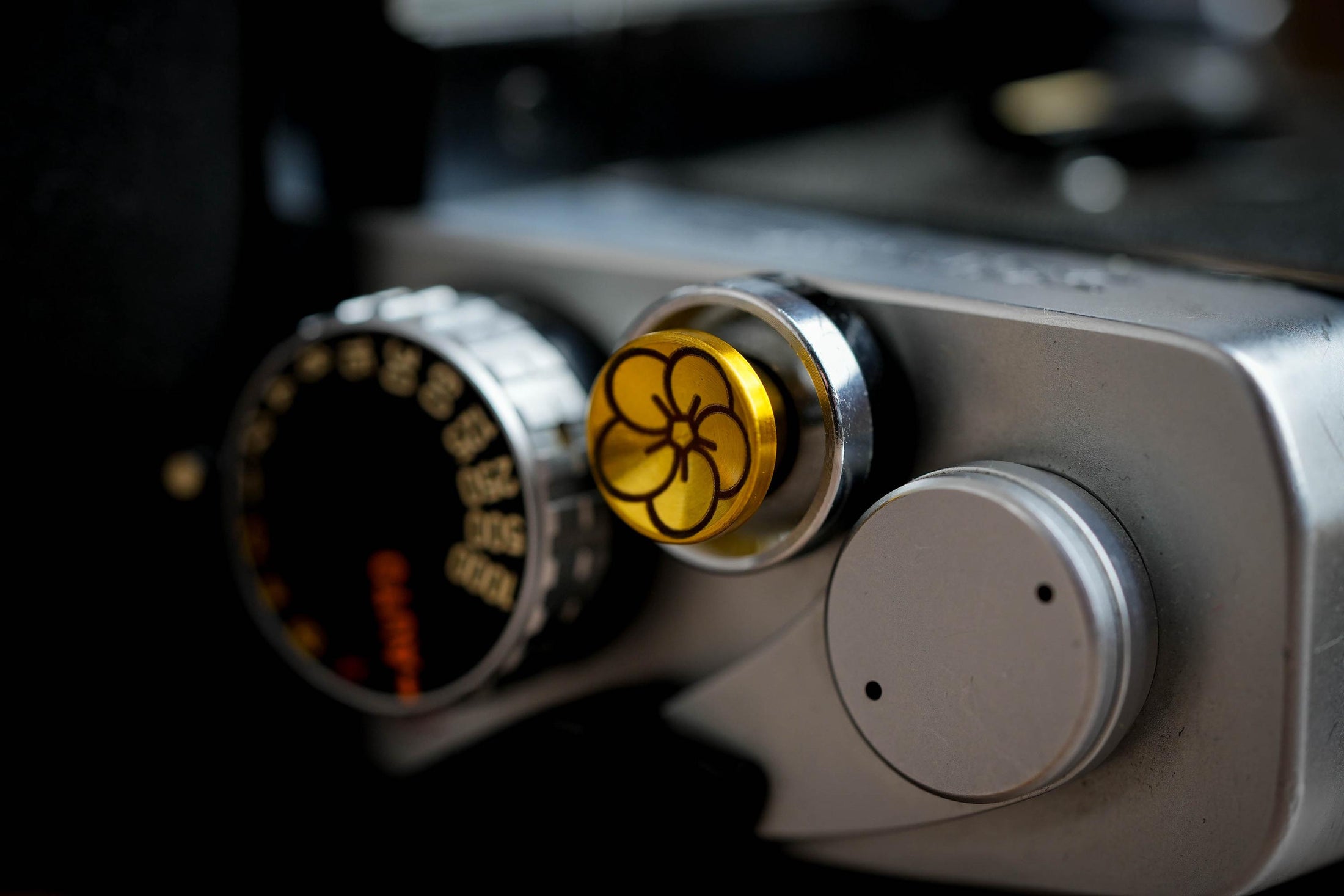 "Shutter button with flower engraving: Give your camera a luxury upgrade with this brass shutter button!"