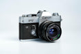 Load image into Gallery viewer, Canon FT QL + Tokina RMC 28mm f/2.8 – Fully functional + free 35mm film
