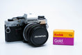 Load image into Gallery viewer, Olympus OM-10 – Olympus G.Zuiko 50mm f/1.4 + Free Kodak Gold 35mm Film
