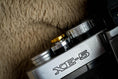 Load image into Gallery viewer, "Shutter button with flower engraving: Give your camera a luxury upgrade with this brass shutter button!"
