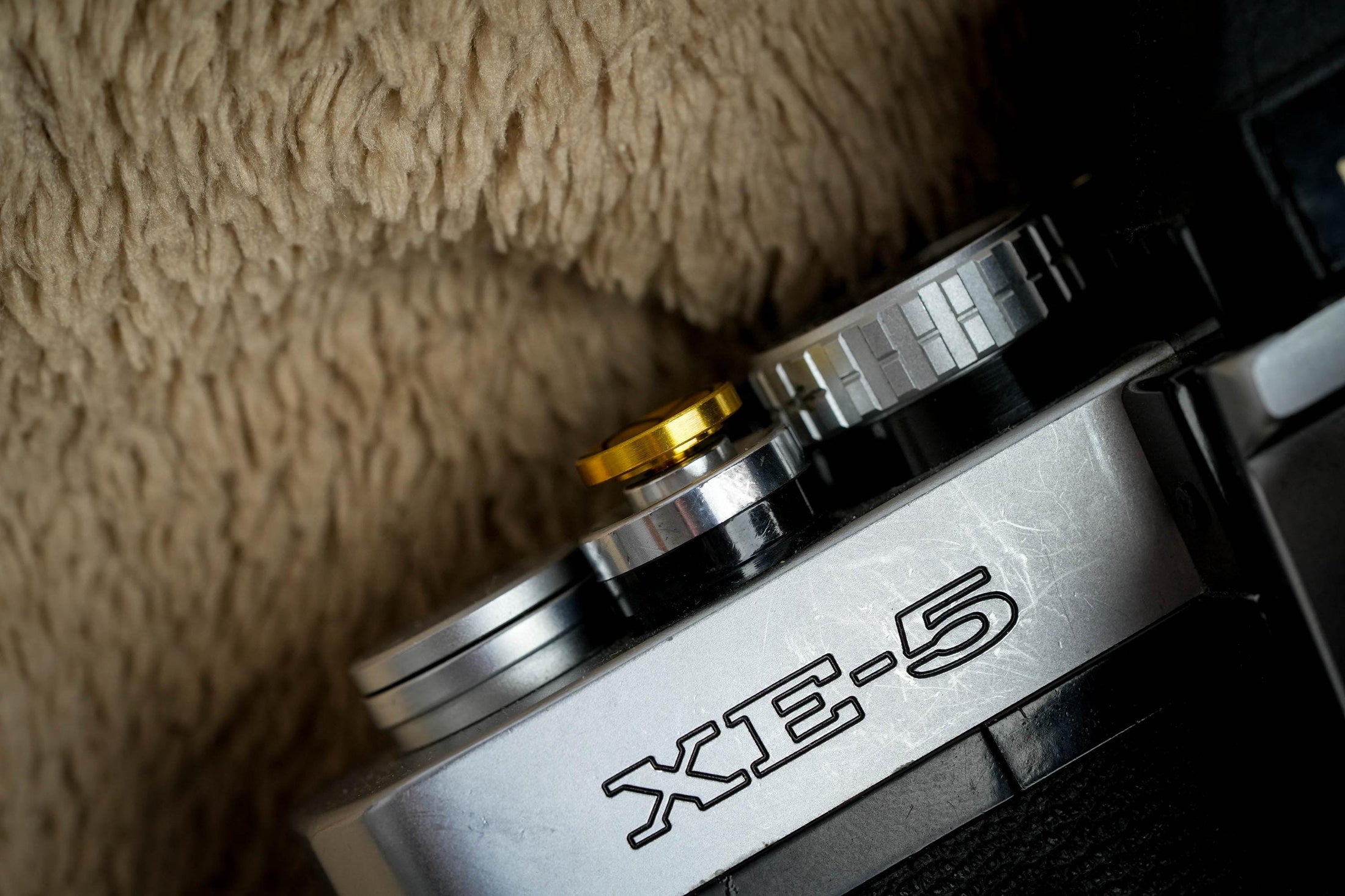 "Shutter button with flower engraving: Give your camera a luxury upgrade with this brass shutter button!"