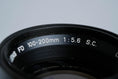 Load image into Gallery viewer, Canon FD 100-200mm f/5.6 S.C. Telezoom – Vintage Classic with Montreal 1976 Lens Hood
