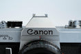 Load image into Gallery viewer, Canon FTb QL + 35-70mm f/3.5-4.5 – Fully working + free 35mm film
