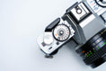 Load image into Gallery viewer, Minolta XG-1 + MC Rokkor-PF 50mm f/1.7 + free Kodak Gold 35mm film
