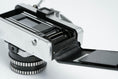 Load image into Gallery viewer, Praktica L + Carl Zeiss Jena 50mm f/2.8 + Free 35mm film – Classic DDR SLR
