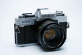 Load image into Gallery viewer, Minolta XG-1 + MC Rokkor-PF 50mm f/1.7 + free Kodak Gold 35mm film
