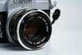 Load image into Gallery viewer, Canon FT QL + 50mm f/1.8 – Fully working + free 35mm film
