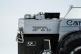 Load image into Gallery viewer, Canon FTb QL + 35-70mm f/3.5-4.5 – Fully working + free 35mm film
