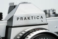 Load image into Gallery viewer, Praktica L + Carl Zeiss Jena 50mm f/2.8 + Free 35mm film – Classic DDR SLR
