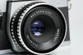 Load image into Gallery viewer, Praktica L + Carl Zeiss Jena 50mm f/2.8 + Free 35mm film – Classic DDR SLR
