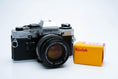 Load image into Gallery viewer, Olympus OM-10 – Zuiko 50mm f/1.8 + Free Kodak Gold 35mm Film
