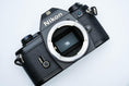 Load image into Gallery viewer, Nikon EM – Nikon Series E 50mm f/1.8 + Free Kodak Gold 35mm Film
