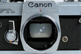 Load image into Gallery viewer, Canon FTb QL + 35-70mm f/3.5-4.5 – Fully working + free 35mm film
