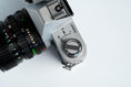 Load image into Gallery viewer, Canon FTb QL + 35-70mm f/3.5-4.5 – Fully working + free 35mm film
