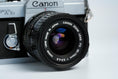 Load image into Gallery viewer, Canon FTb QL + 35-70mm f/3.5-4.5 – Fully working + free 35mm film
