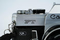 Load image into Gallery viewer, Canon FT QL + 50mm f/1.8 – Fully working + free 35mm film
