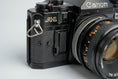 Load image into Gallery viewer, Canon A-1 Black – Vintage 35mm SLR with Canon FD 50mm f/1.8 Lens – Tested and Working
