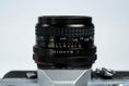 Load image into Gallery viewer, Canon FT QL + Tokina RMC 28mm f/2.8 – Fully functional + free 35mm film
