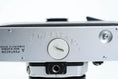 Load image into Gallery viewer, 'Praktica MTL 5 + Domiplan 50mm f/2.8 + free 35mm film – Reliable vintage SLR'
