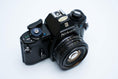 Load image into Gallery viewer, Nikon EM – Nikon Series E 50mm f/1.8 + Free Kodak Gold 35mm Film

