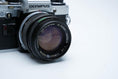 Load image into Gallery viewer, Olympus OM-10 – Olympus G.Zuiko 50mm f/1.4 + Free Kodak Gold 35mm Film
