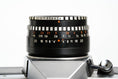 Load image into Gallery viewer, 'Praktica MTL 5 + Domiplan 50mm f/2.8 + free 35mm film – Reliable vintage SLR'
