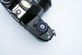 Load image into Gallery viewer, Nikon EM – Nikon Series E 50mm f/1.8 + Free Kodak Gold 35mm Film
