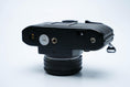 Load image into Gallery viewer, Nikon EM – Nikon Series E 50mm f/1.8 + Free Kodak Gold 35mm Film
