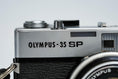 Load image into Gallery viewer, Olympus 35 SP + G. Zuiko 42mm f/1.7 + Free Kodak Gold – Rare rangefinder | Fully working | With learning cover and lens cap
