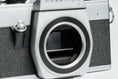 Load image into Gallery viewer, Praktica L + Carl Zeiss Jena 50mm f/2.8 + Free 35mm film – Classic DDR SLR
