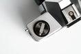 Load image into Gallery viewer, 'Praktica MTL 5 + Domiplan 50mm f/2.8 + free 35mm film – Reliable vintage SLR'

