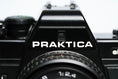 Load image into Gallery viewer, 'Praktica BCA + Prakticar 50mm f/2.4 + free 35mm film – Electronic vintage SLR'
