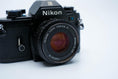 Load image into Gallery viewer, Nikon EM – Nikon Series E 50mm f/1.8 + Free Kodak Gold 35mm Film
