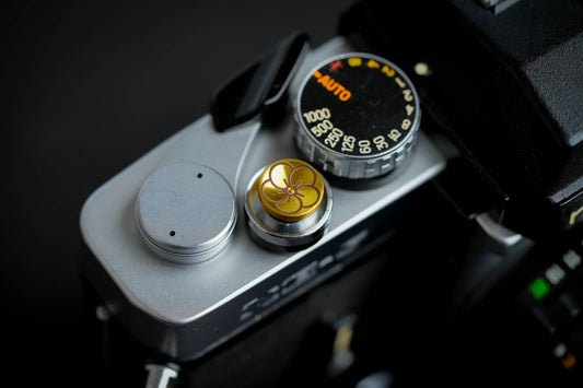 "Shutter button with flower engraving: Give your camera a luxury upgrade with this brass shutter button!"