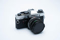 Load image into Gallery viewer, Olympus OM-10 – Zuiko 50mm f/1.8 + Free Kodak Gold 35mm Film
