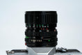 Load image into Gallery viewer, Canon FTb QL + 35-70mm f/3.5-4.5 – Fully working + free 35mm film
