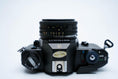 Load image into Gallery viewer, Nikon EM – Nikon Series E 50mm f/1.8 + Free Kodak Gold 35mm Film

