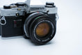 Load image into Gallery viewer, Olympus OM-10 – Zuiko 50mm f/1.8 + Free Kodak Gold 35mm Film
