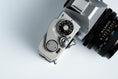 Load image into Gallery viewer, Canon FT QL + Tokina RMC 28mm f/2.8 – Fully functional + free 35mm film
