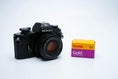 Load image into Gallery viewer, Nikon EM – Nikon Series E 50mm f/1.8 + Free Kodak Gold 35mm Film
