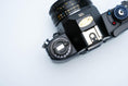 Load image into Gallery viewer, Nikon EM – Nikon Series E 50mm f/1.8 + Free Kodak Gold 35mm Film

