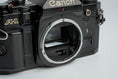 Load image into Gallery viewer, Canon A-1 Black – Vintage 35mm SLR with Canon FD 50mm f/1.8 Lens – Tested and Working
