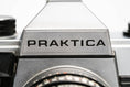 Load image into Gallery viewer, 'Praktica MTL 5 + Domiplan 50mm f/2.8 + free 35mm film – Reliable vintage SLR'
