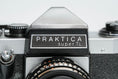 Load image into Gallery viewer, Praktica Super TL + Meyer-Optik Görlitz Domiplan 50mm f/2.8 + free 35mm film – Vintage SLR
