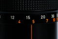Load image into Gallery viewer, Canon FD 100-200mm f/5.6 S.C. Telezoom – Vintage Classic with Montreal 1976 Lens Hood
