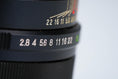 Load image into Gallery viewer, Tokina 135mm f/2.8 – Vintage Telephoto Lens for Canon FD
