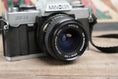 Load image into Gallery viewer, Minolta XG-1 + MD 28mm f3.5 lens - vintage SLR camera
